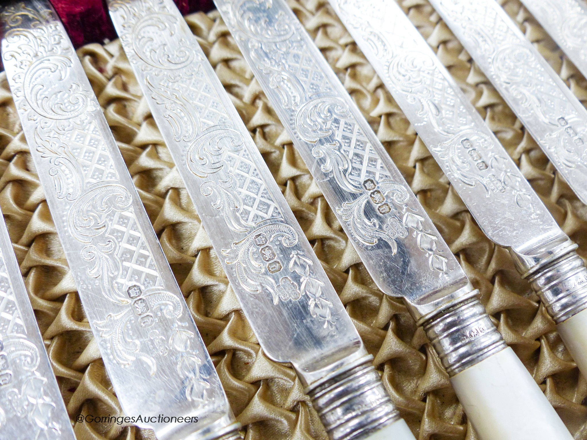A cased set of twelve pairs of late Victorian mother of pearl handled silver dessert eaters, Z. Barraclough & Sons, Sheffield, 1896.